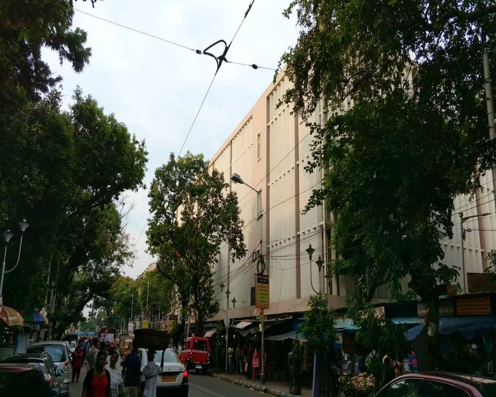 Neighbourhood,Town,Overhead power line,Residential area,Street,Tree,Urban area,Architecture,Electricity,Sky