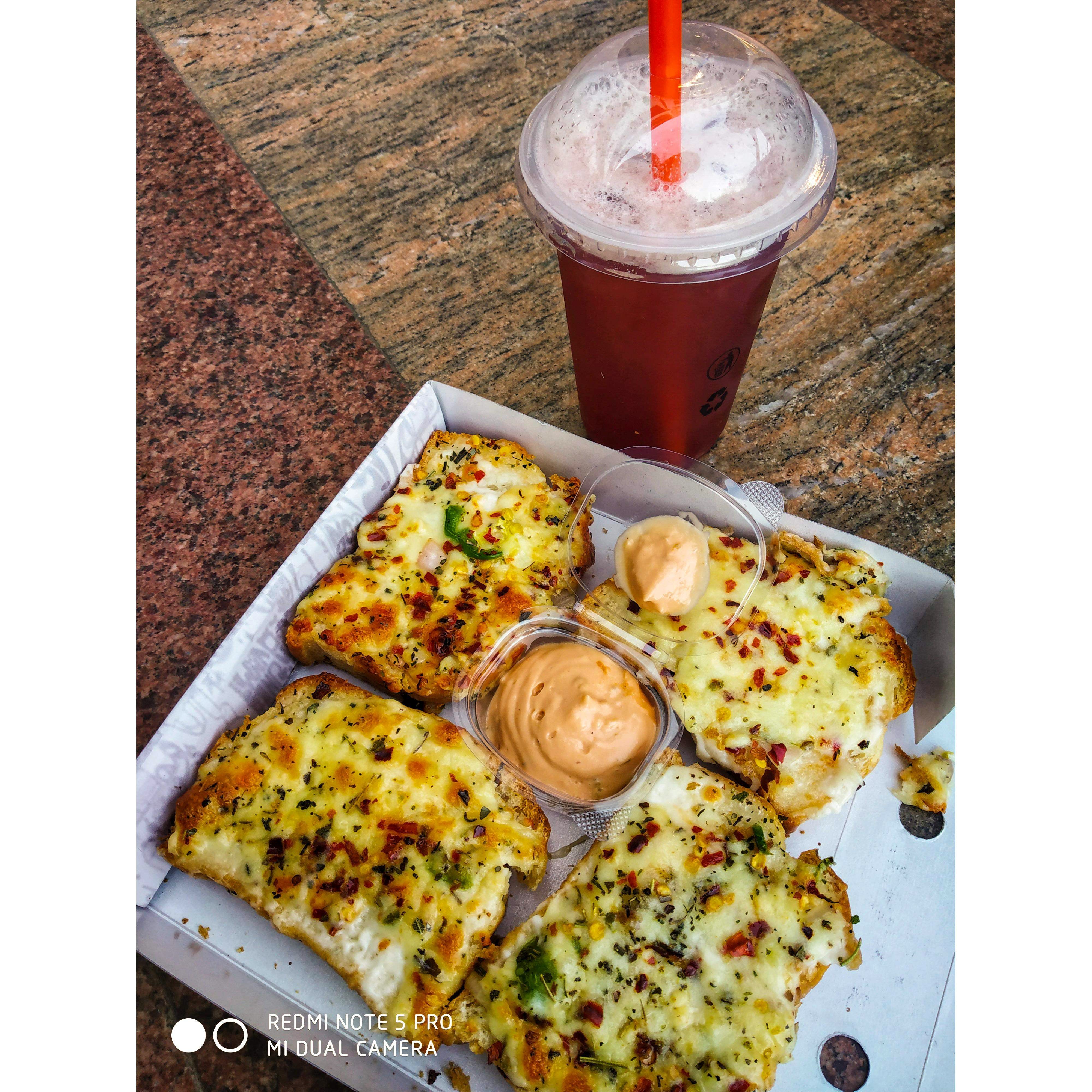 Drive Through This Cute Little Bistro To Have Amazing Garlic Bread