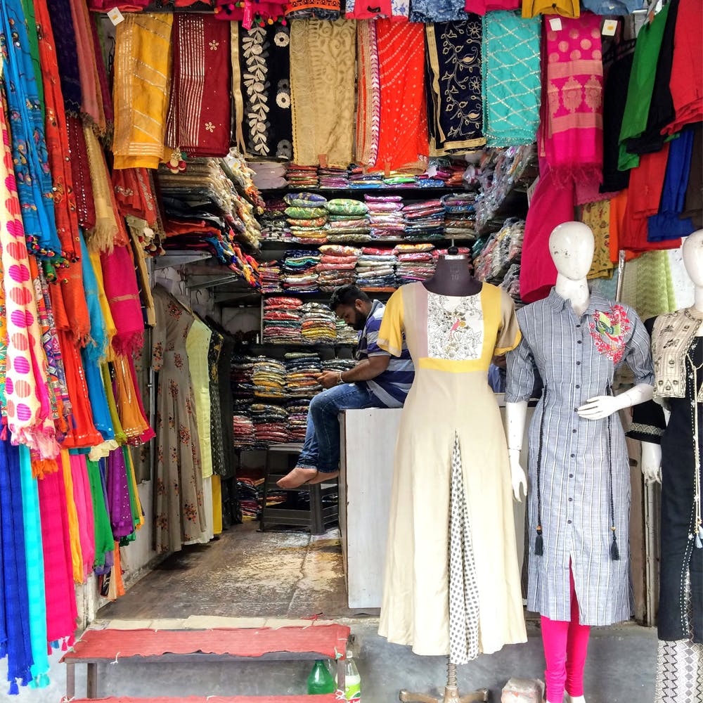 Bazaar,Market,Public space,Human settlement,Marketplace,Selling,Textile,Boutique,Dress,City