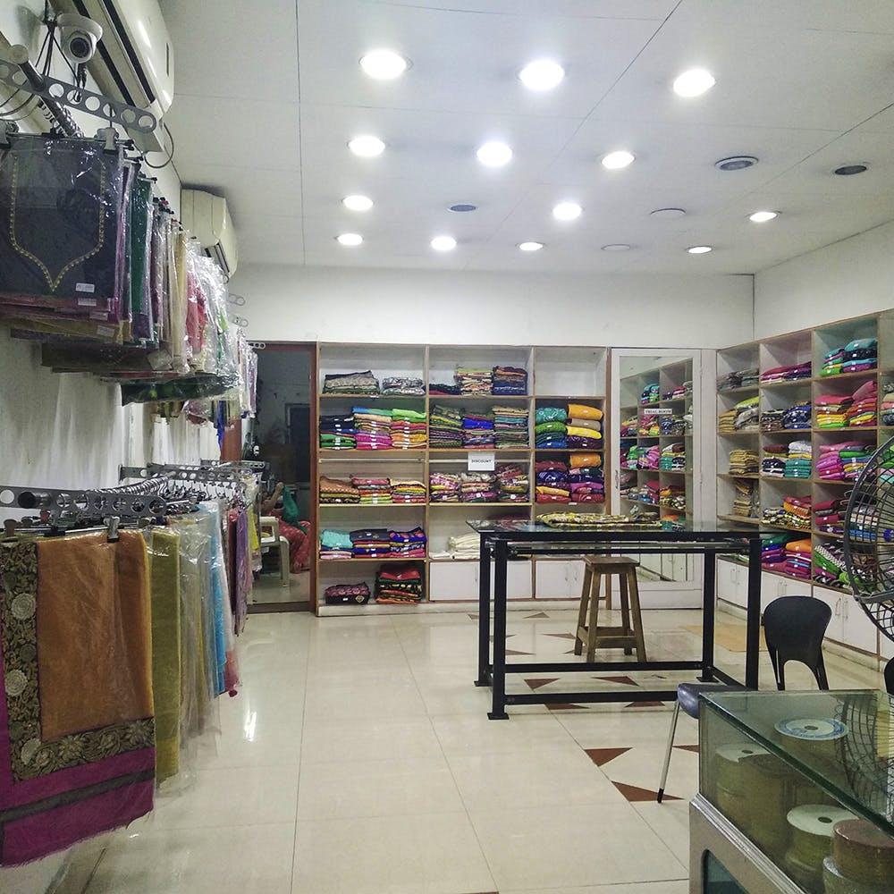 Building,Outlet store,Interior design,Retail,Floor,Aisle,Footwear,Textile,Architecture,Ceiling