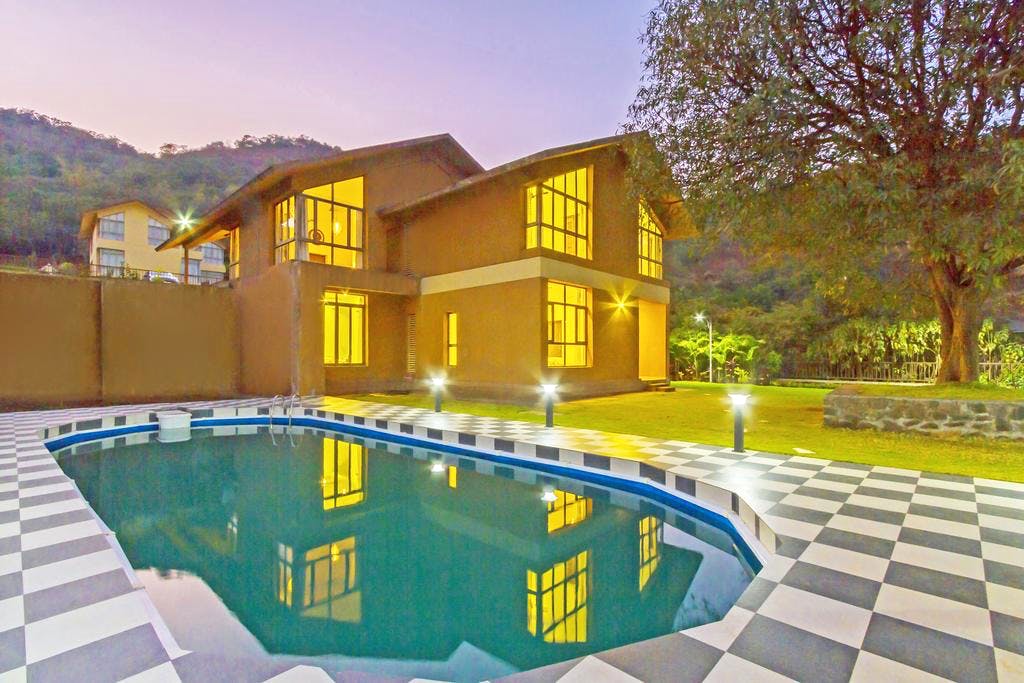 Property,Home,House,Building,Swimming pool,Natural landscape,Estate,Yellow,Real estate,Residential area
