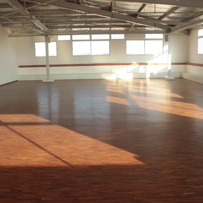 Floor,Wood flooring,Sport venue,Flooring,Hardwood,Wood,Room,Hall,Building,Laminate flooring