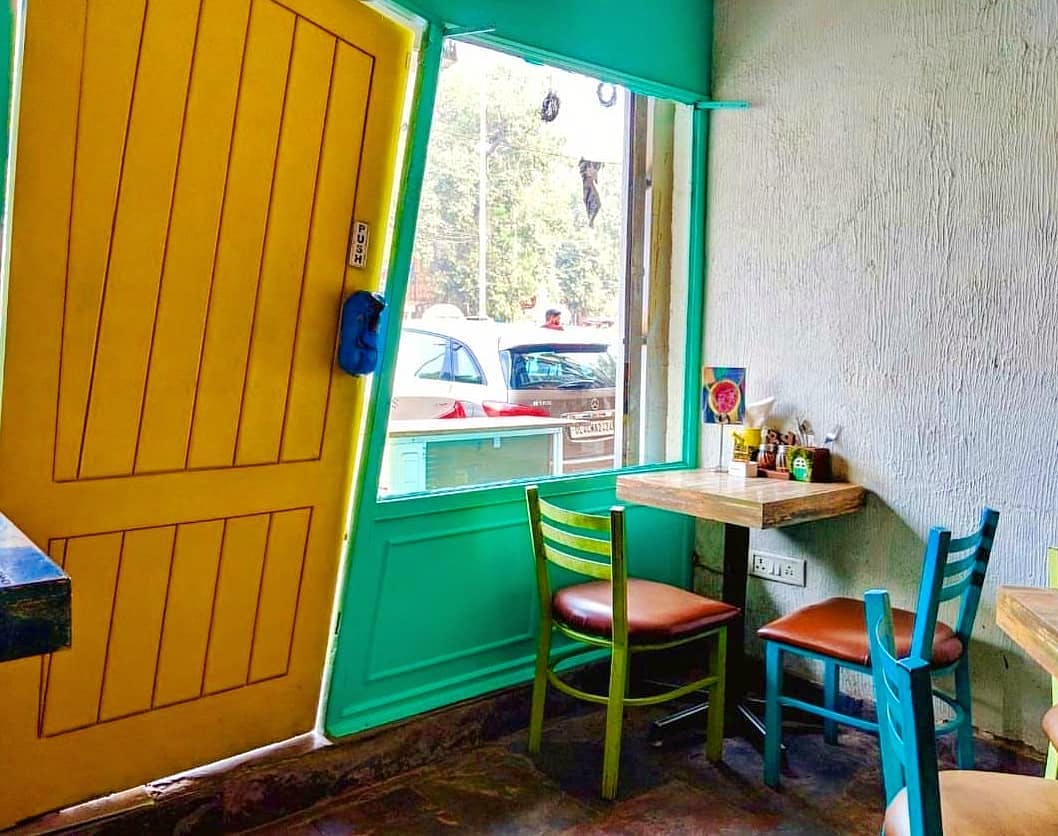 Green,Blue,Turquoise,Room,Yellow,Furniture,Wall,Table,Interior design,Building