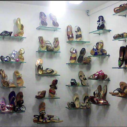 Footwear,Shelf,Collection,Shoe store,Shoe,Shelving,Display case