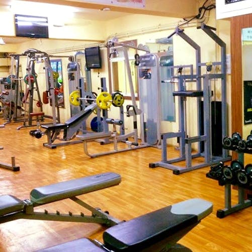 Gym,Room,Sport venue,Exercise equipment,Physical fitness,Exercise machine,Weightlifting machine,Bench,Weight training,Leisure centre