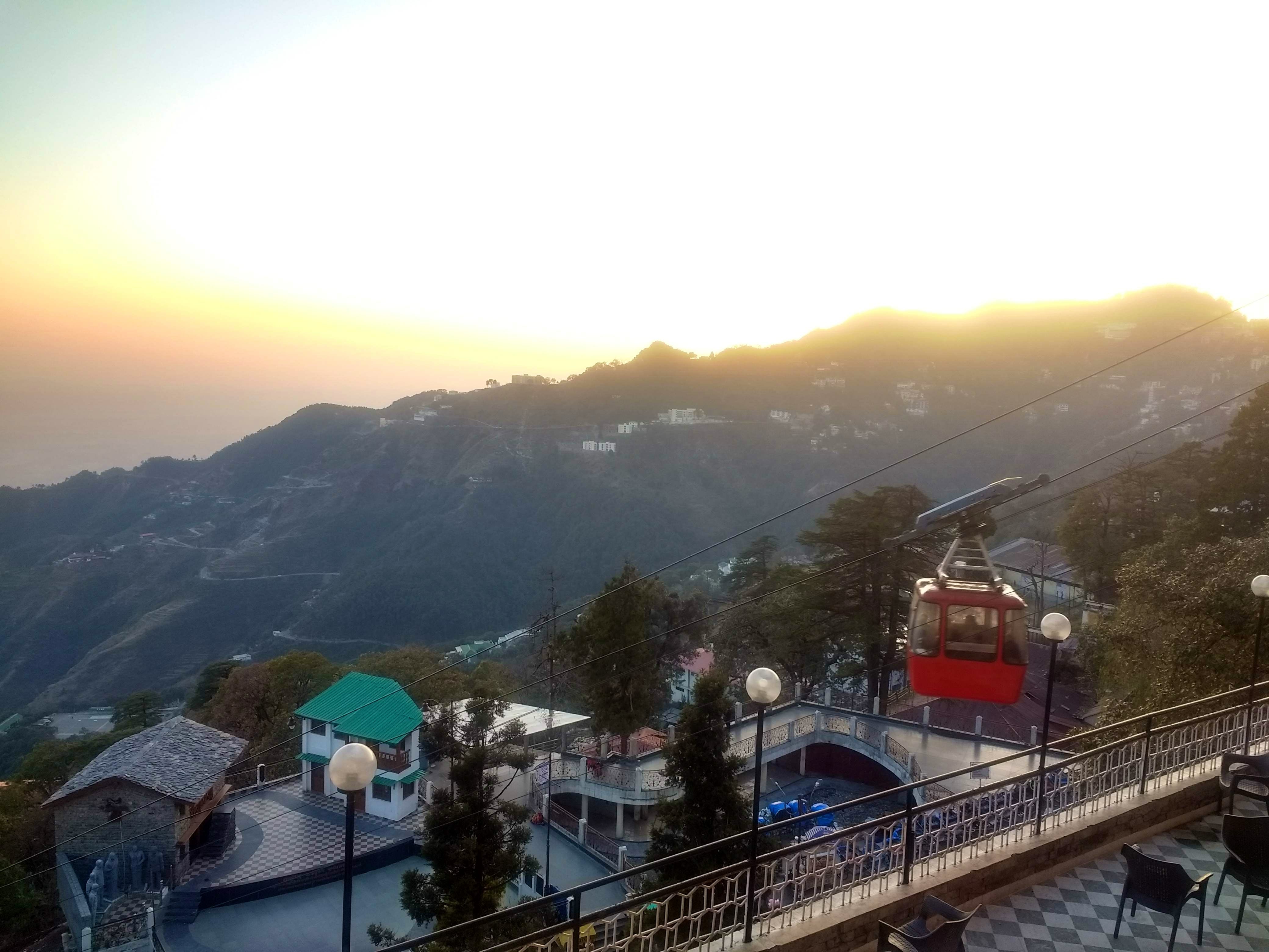 Sky,Mountain,Mountainous landforms,Hill station,Town,Cloud,Mountain range,Morning,Tourism,Tree