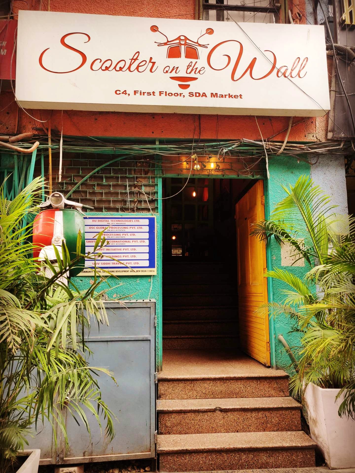 Building,Restaurant,Door,Architecture,Facade,House,Plant,Signage