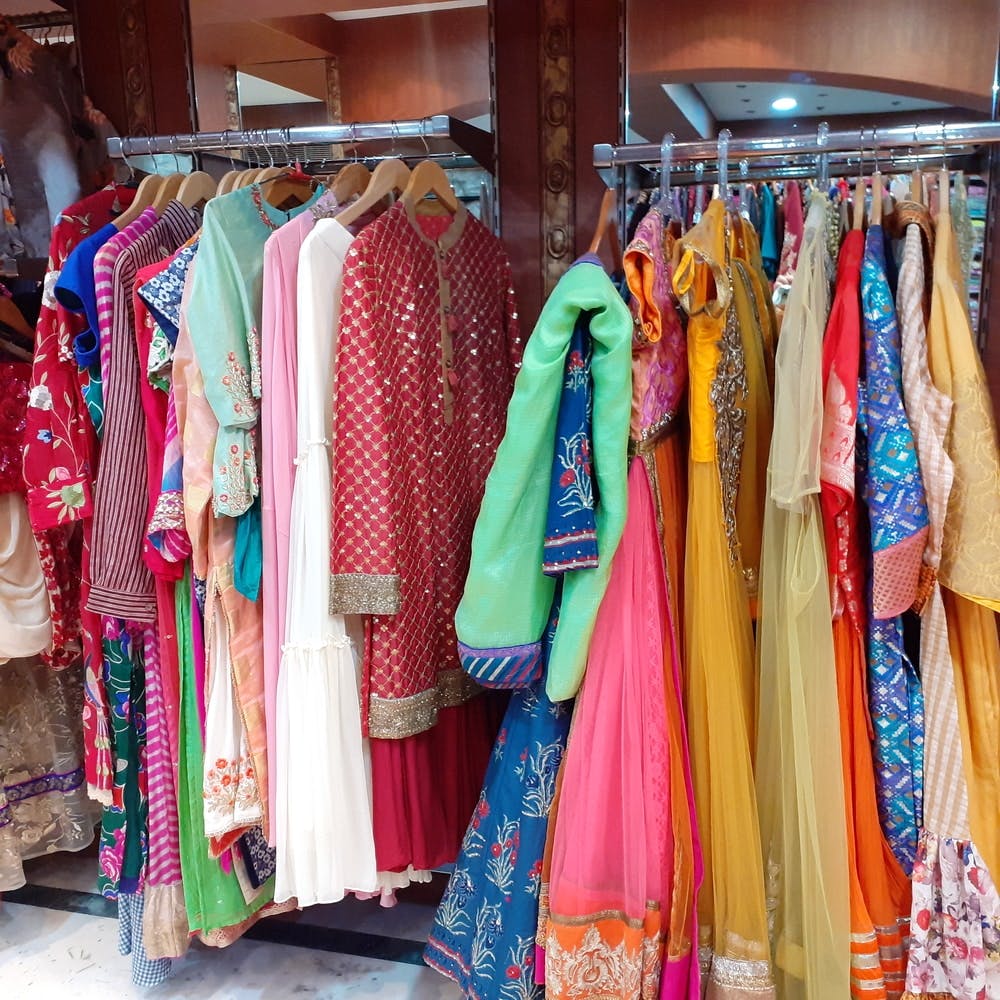 Clothing,Boutique,Bazaar,Textile,Room,Clothes hanger,Dress,Selling,Market,Formal wear