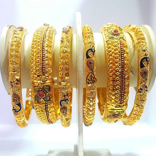 Jewellery,Bangle,Gold,Fashion accessory,Metal,Bracelet,Body jewelry