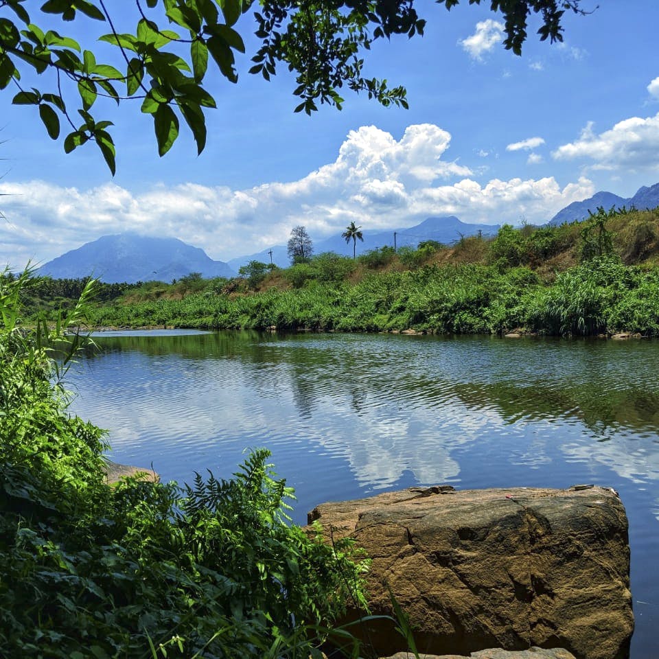 Body of water,Nature,Natural landscape,Water resources,Water,Reflection,Vegetation,Sky,Lake,Blue