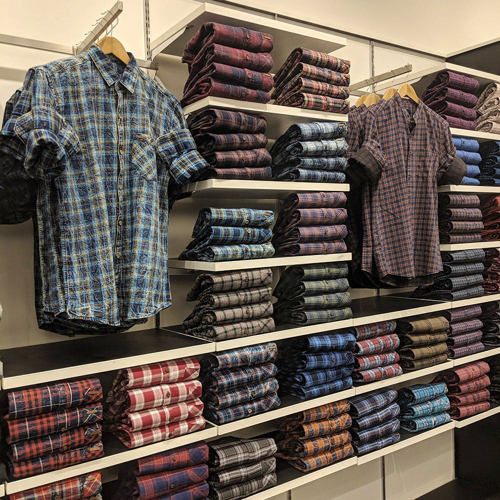 Textile,Plaid,Outlet store,Pattern,Room,Inventory,Shirt,Tartan,Retail,Dress shirt