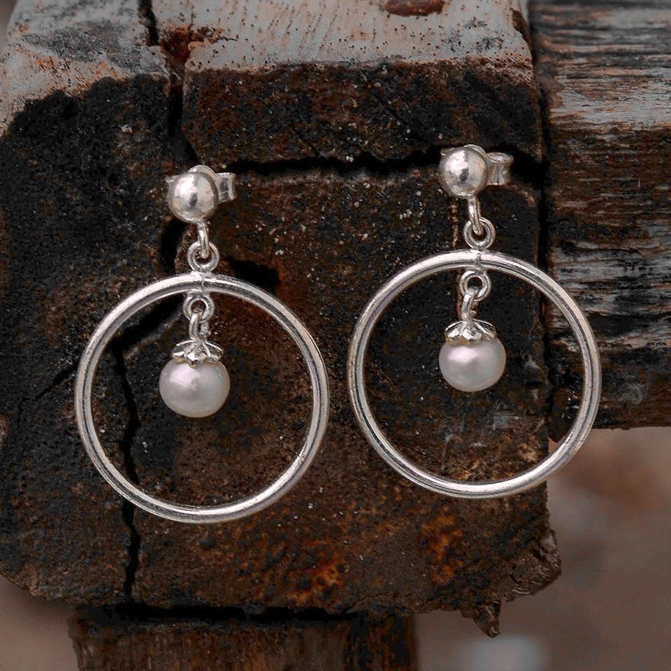 Earrings,Jewellery,Fashion accessory,Pearl,Body jewelry,Silver,Gemstone,Silver,Metal,Circle