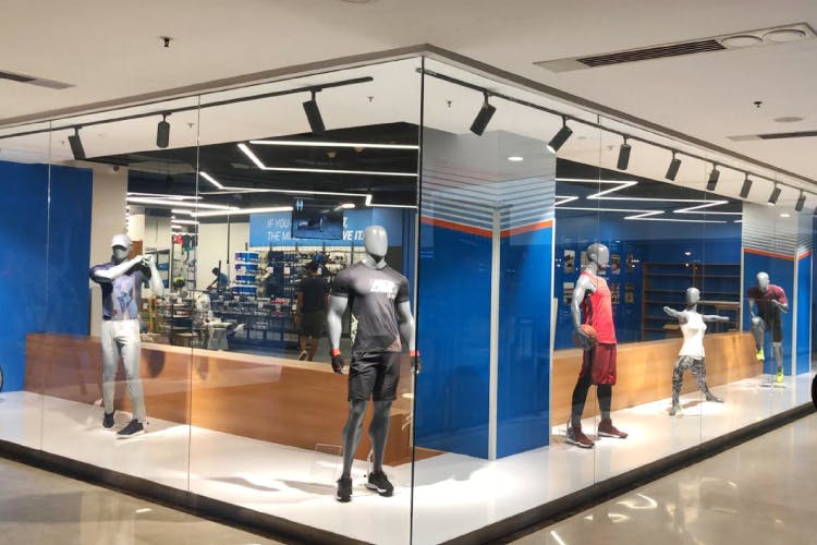 Building,Display case,Retail,Display window,Interior design,Ceiling,Room,Sportswear,Glass,Flooring