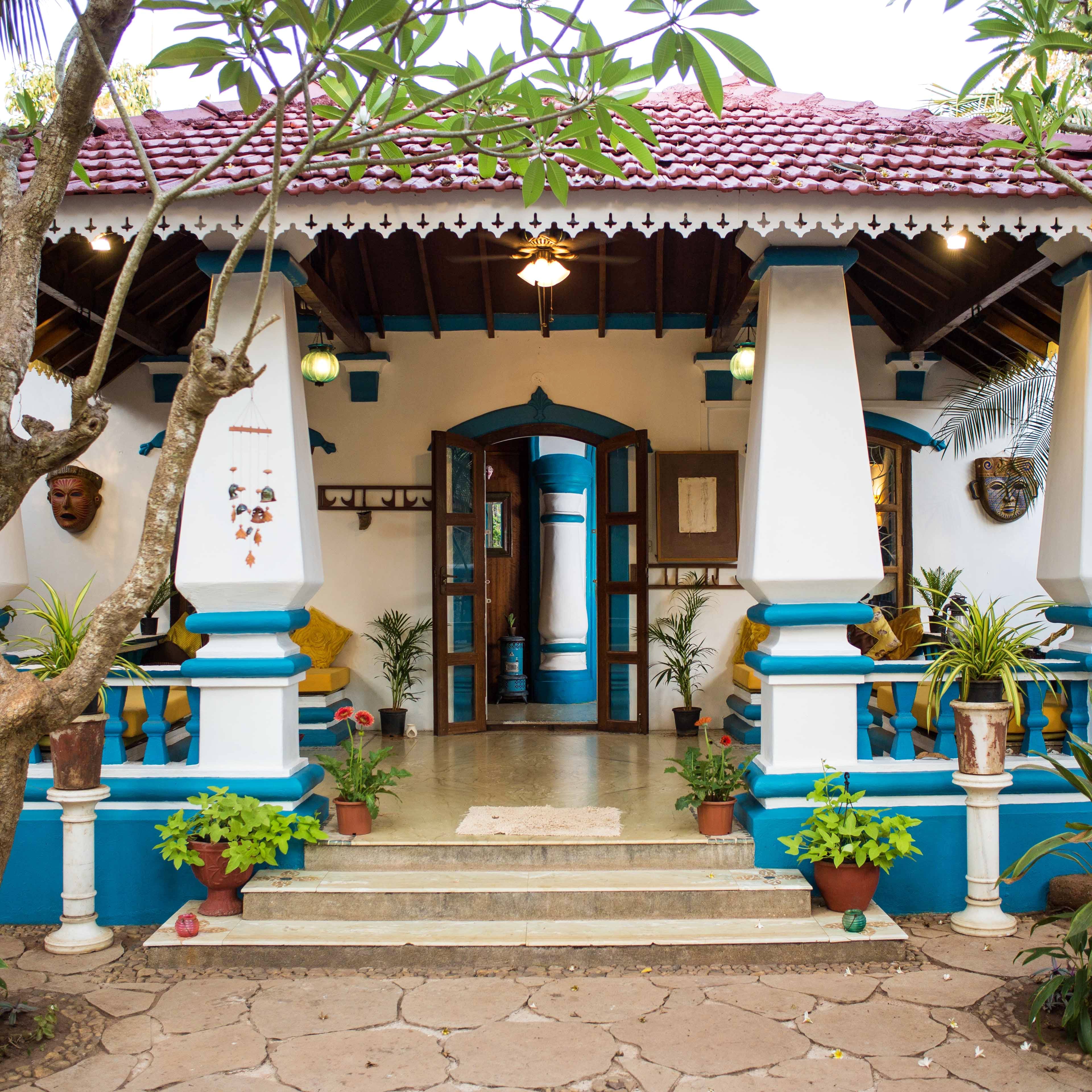 Building,Majorelle blue,House,Architecture,Facade,Leisure,Courtyard,Temple,Plant,Home