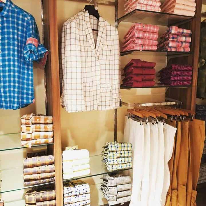 Clothing,Clothes hanger,Plaid,Boutique,Room,Closet,Textile,Outlet store,Shirt
