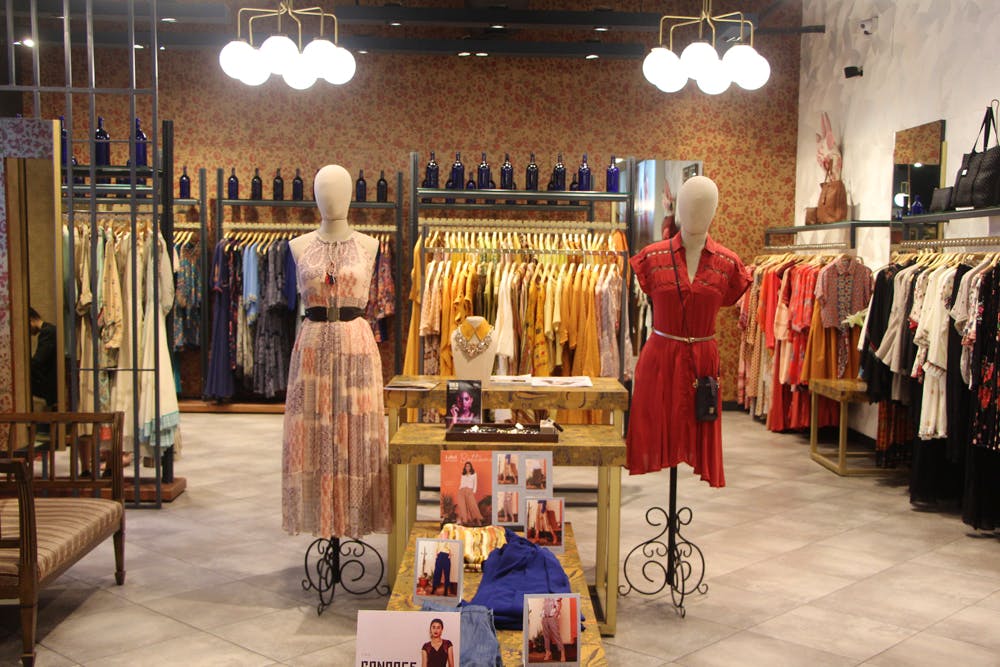 Boutique,Fashion,Retail,Outlet store,Building,Interior design,Textile,Room,Costume design,Shopping