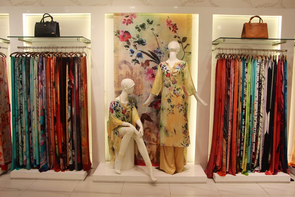 Room,Boutique,Textile,Fashion,Furniture,Interior design,Costume design,Dress,Shelf,Collection