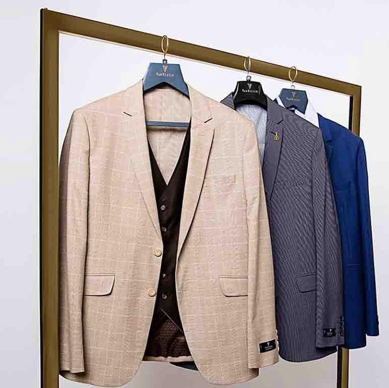 Suit,Clothing,Clothes hanger,Outerwear,Blazer,Formal wear,Jacket,Tuxedo,Room,Beige