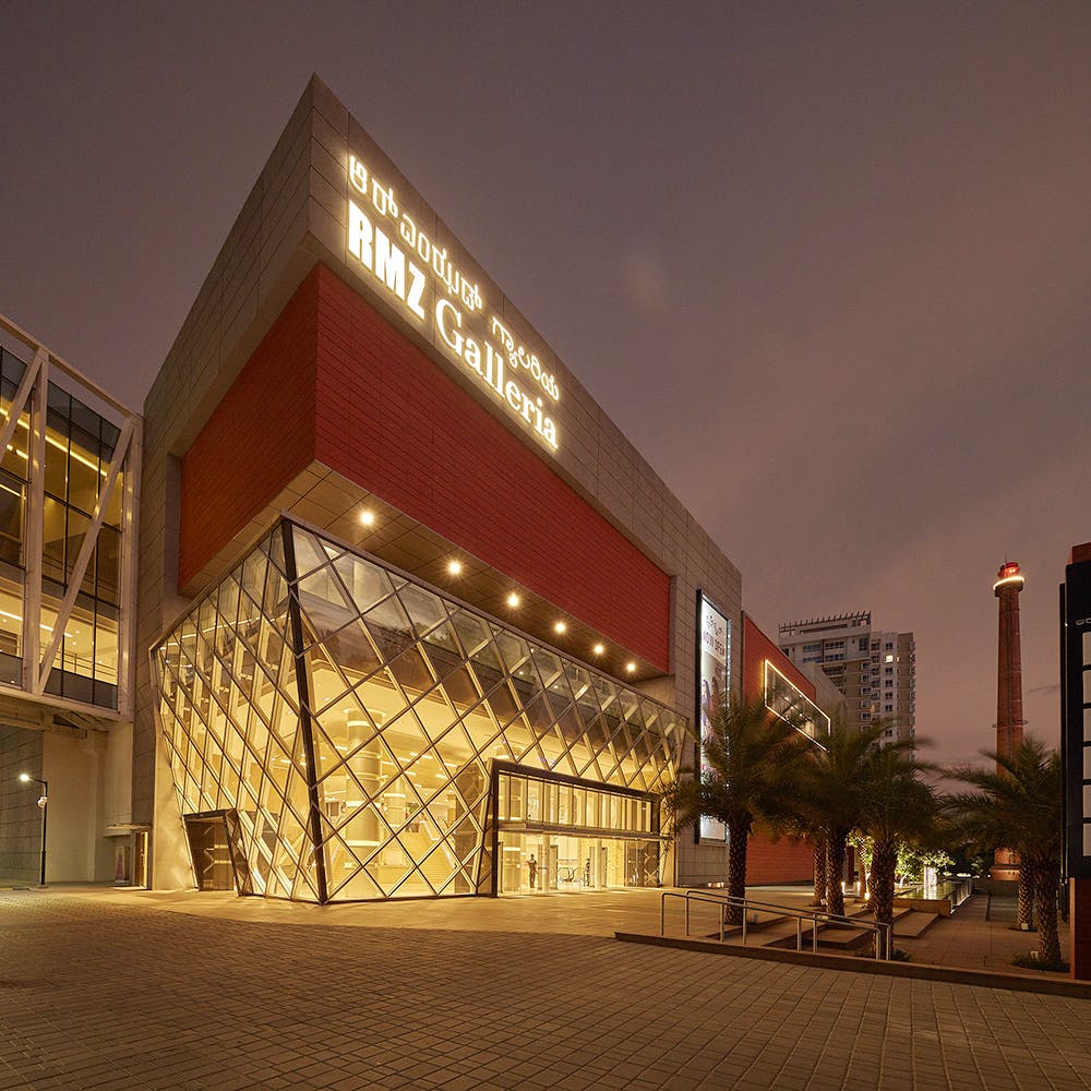 Architecture,Building,Mixed-use,Metropolitan area,Night,Lighting,Sky,Facade,Commercial building,City