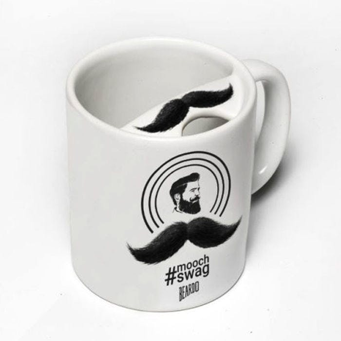 Moustache,Hair,Mug,Hairstyle,Drinkware,Tableware,Shoe,Logo