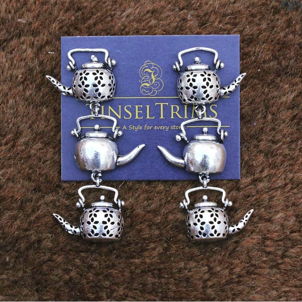 Silver,Fashion accessory,Jewellery,Earrings,Font,Silver,Metal,Tableware,Tea set