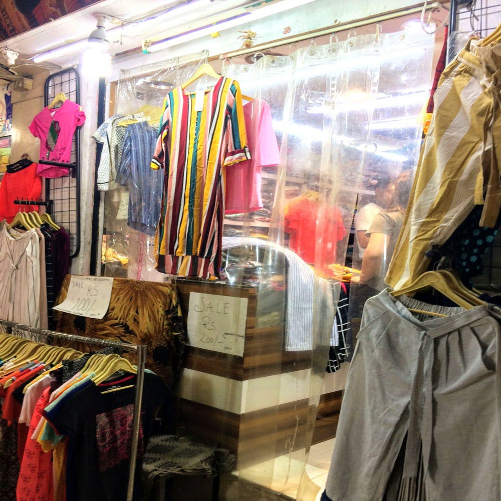 Boutique,Clothing,Selling,Public space,Bazaar,Outlet store,Marketplace,Textile,Fashion,Shopping