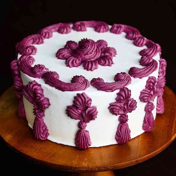 Cake,Cake decorating,Buttercream,Icing,Sugar paste,Purple,Dessert,Birthday cake,Food,Baked goods