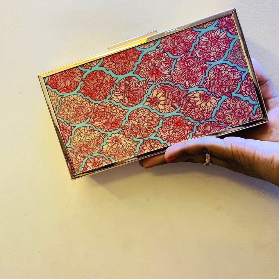 Red,Pattern,Orange,Motif,Visual arts,Design,Wallet,Paisley,Coin purse,Fashion accessory