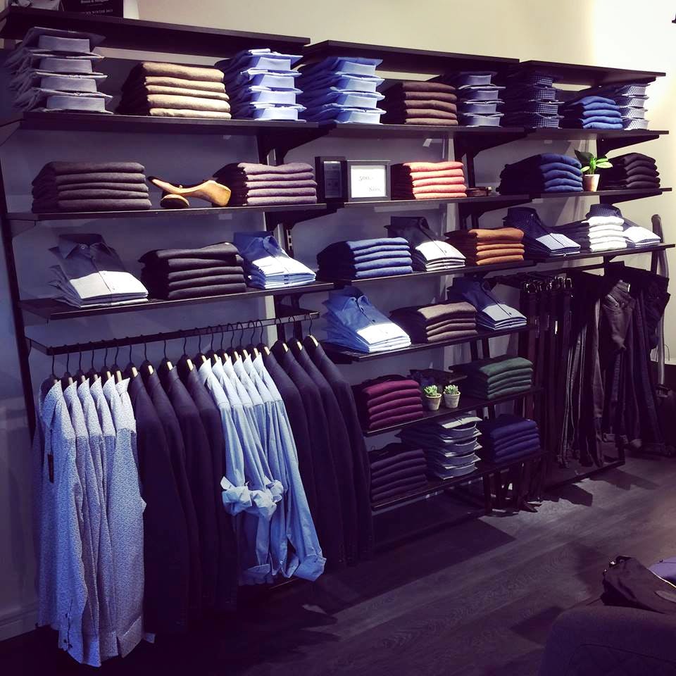 Clothes hanger,Blue,Shelf,Room,Wall,Furniture,Textile,Closet,Shelving,Jeans