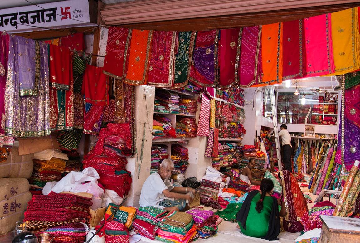 Bazaar,Market,Marketplace,Public space,Selling,Human settlement,Retail,Building,Textile,Shopping