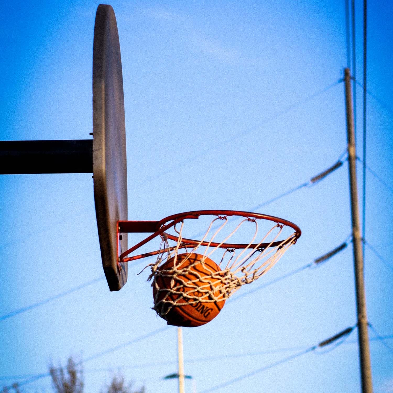 Basketball,Basketball hoop,Basketball court,Basketball,Sky,Streetball,Net,Team sport,Netball,Ball
