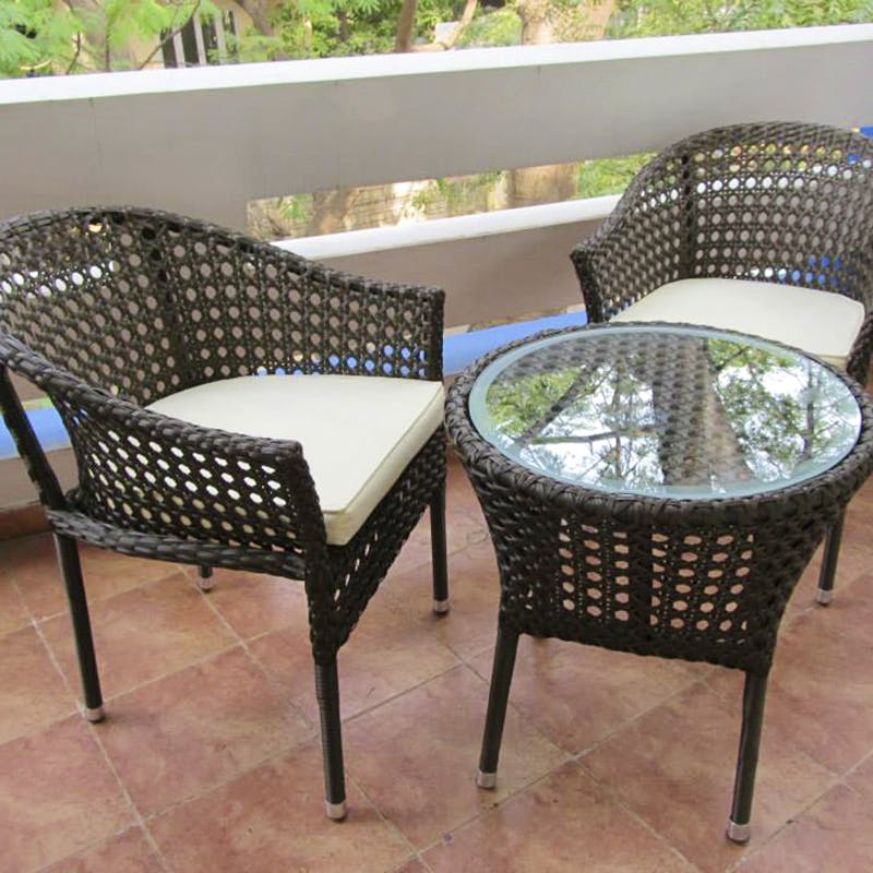 Chair,Furniture,Wicker,Outdoor furniture,Outdoor table,Patio,Armrest,Table,Coffee table,Room