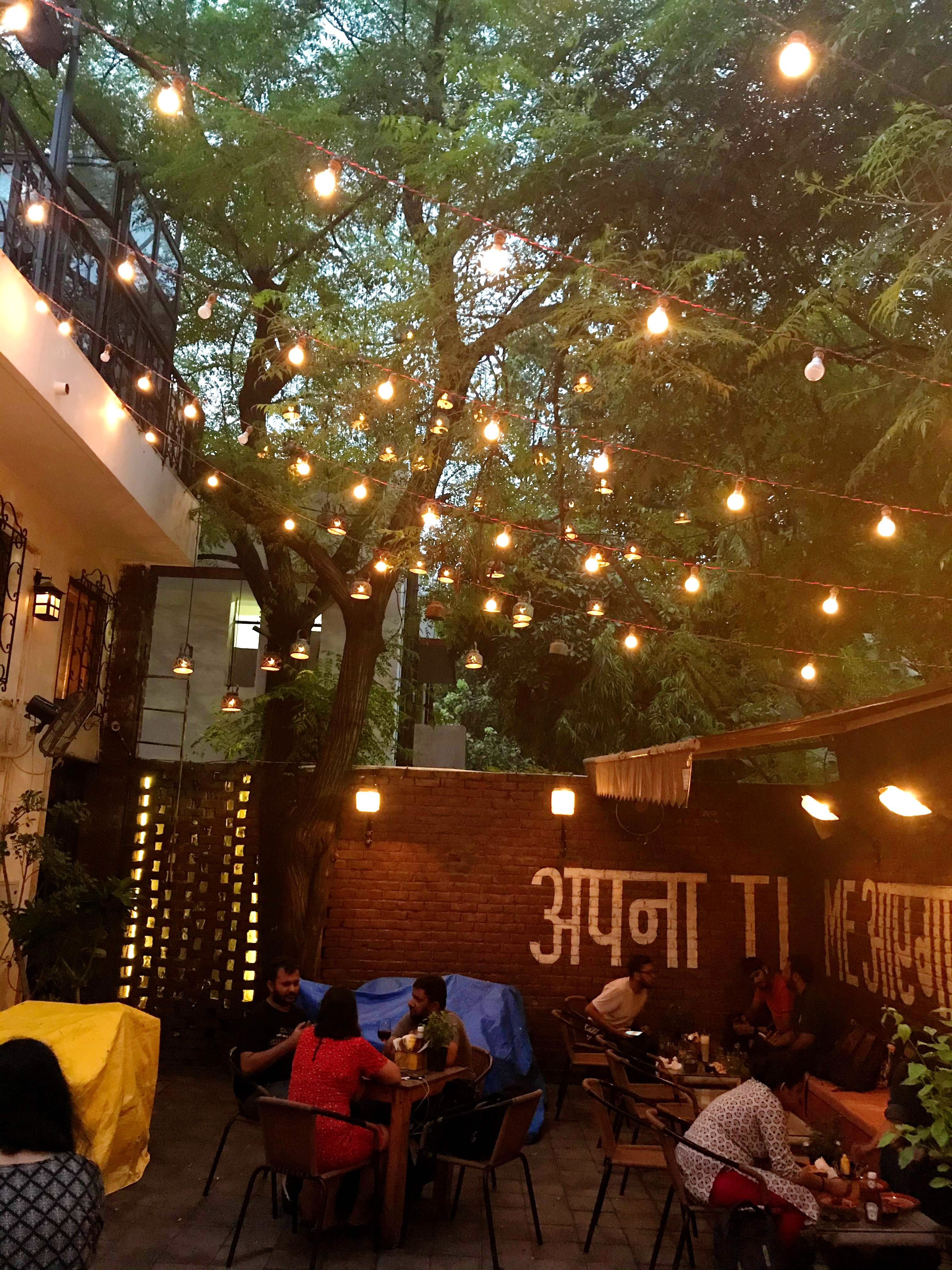 Restaurant,Lighting,Tree,Night,Table,Building,Plant,Café,Business