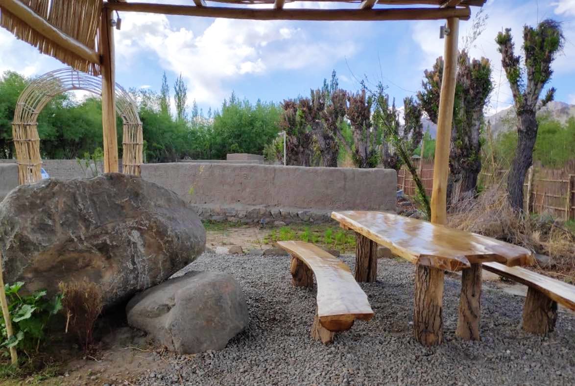 Backyard,Tree,Landscape,Landscaping,Table,Rock,Furniture