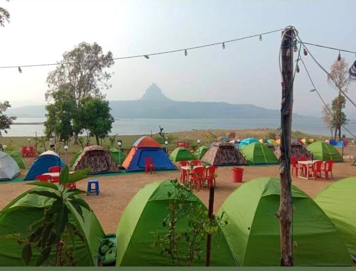 Hill station,Tent,Grass,Adaptation,Rural area,Leisure,Land lot,Recreation,Landscape,Plant