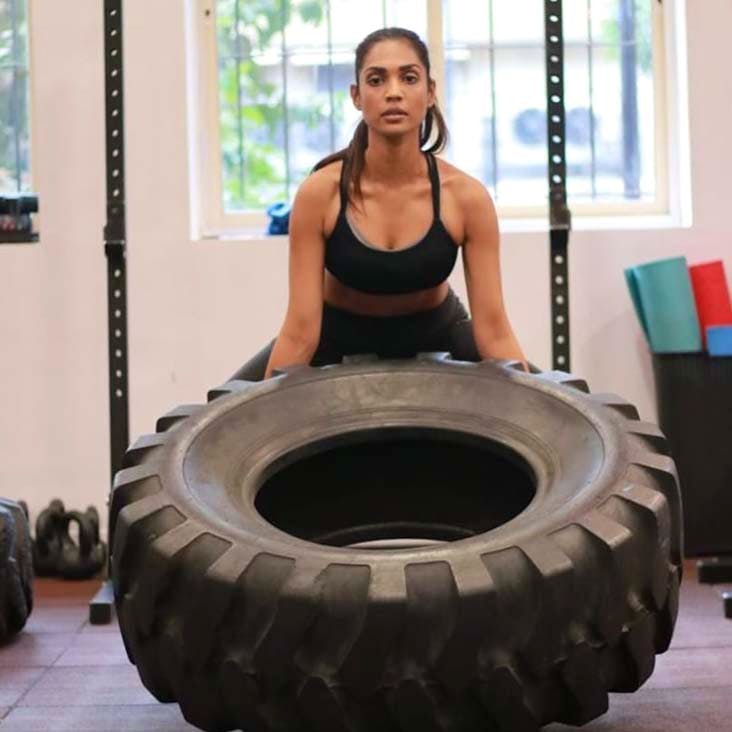 Tire,Automotive tire,Physical fitness,Strength athletics,Auto part,Shoulder,Automotive wheel system,Exercise,Wheel,Weight training