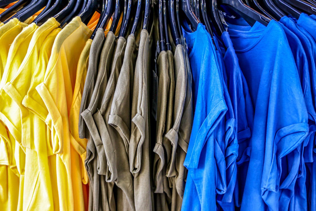 Blue,Clothing,Yellow,Clothes hanger,Textile,Dry cleaning,Wardrobe,Electric blue,T-shirt
