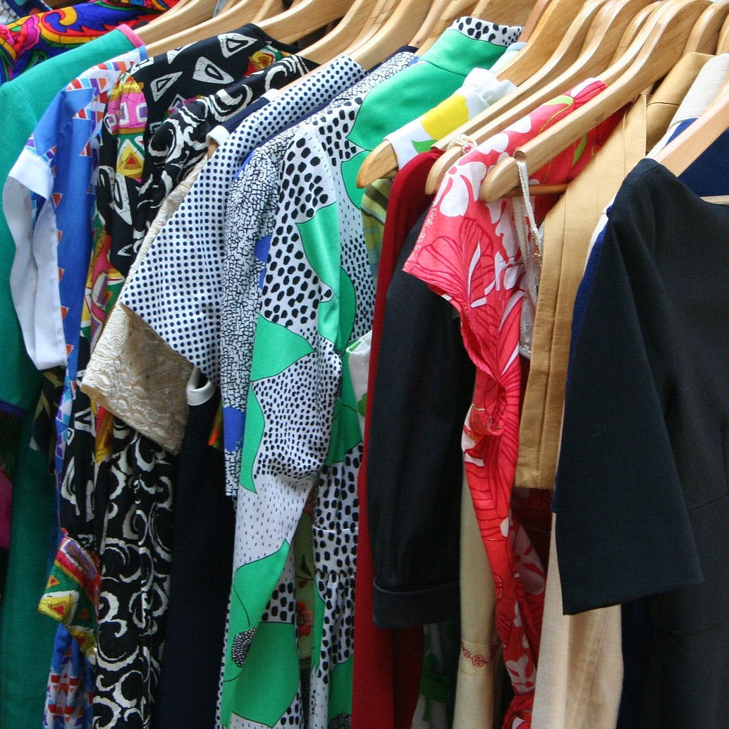 Clothing,Textile,Boutique,Clothes hanger,Room,Outerwear,Dress,T-shirt,Costume,Linens