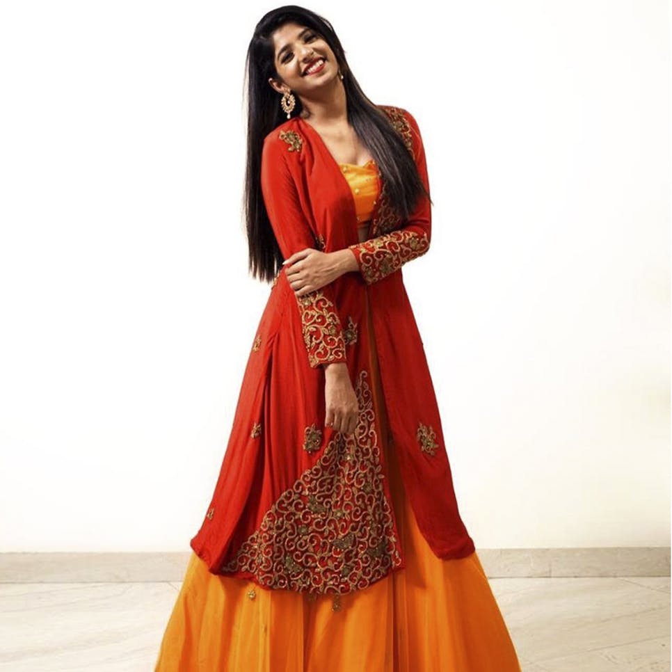 Clothing,Orange,Formal wear,Dress,Red,Yellow,Gown,Sari,Fashion model,Maroon