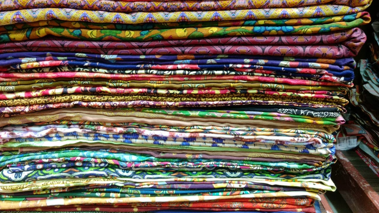 Textile,Pattern,Thread,Woven fabric,Art,Fashion accessory,Wool,Pattern,Craft,Bangle