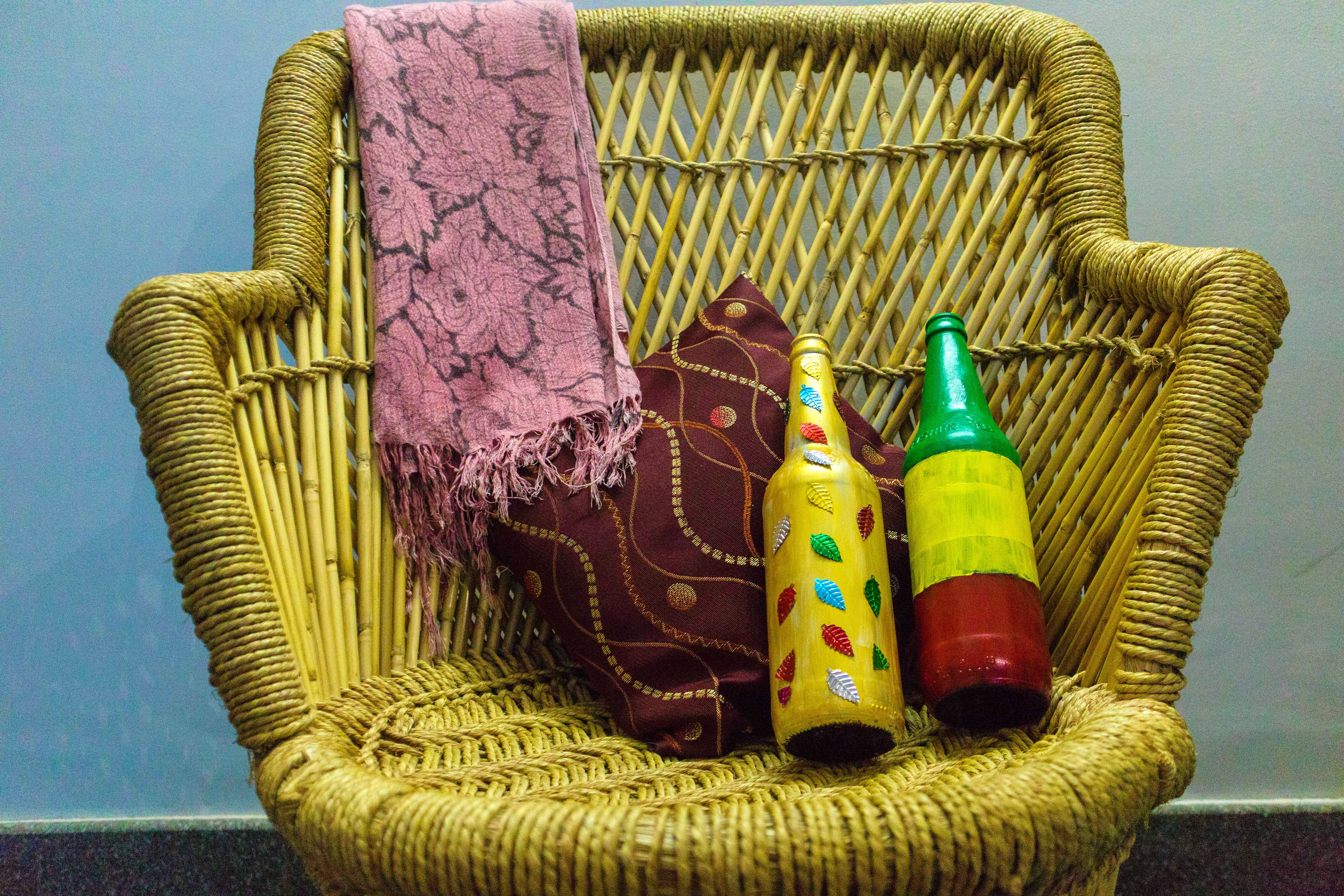 Wicker,Picnic basket,Basket,Bottle,Still life,Home accessories,Glass bottle,Furniture