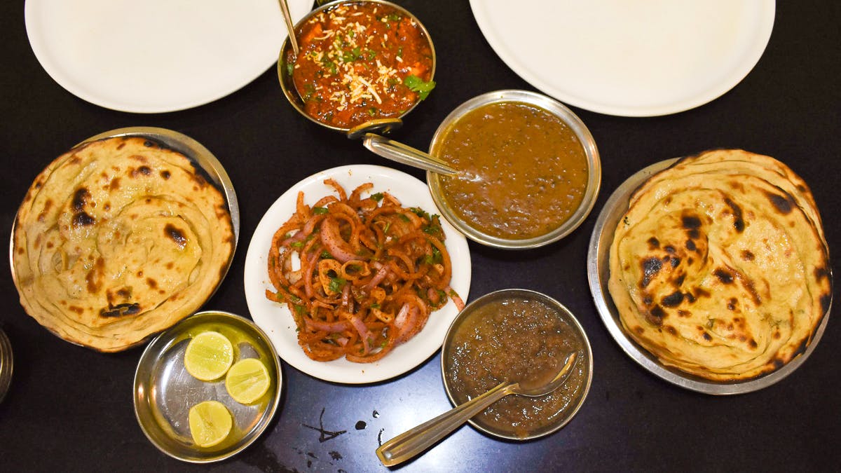 Dish,Food,Cuisine,Ingredient,Paratha,Roti prata,Kerala porotta,Punjabi cuisine,Naan,Roti canai