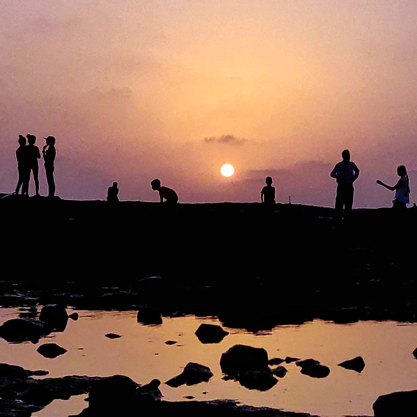 People in nature,Sky,Water,Silhouette,Sunset,Reflection,Horizon,Sea,Cloud,Evening