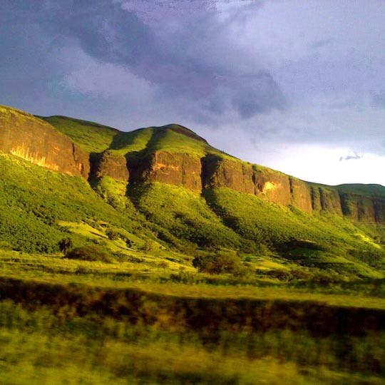 Highland,Mountainous landforms,Nature,Natural landscape,Hill,Mountain,Green,Sky,Grassland,Wilderness