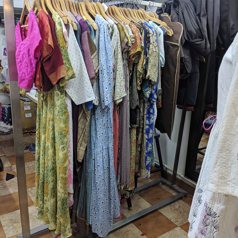 Boutique,Clothing,Room,Clothes hanger,Dress,Textile,Closet,Bazaar,Outerwear,Selling