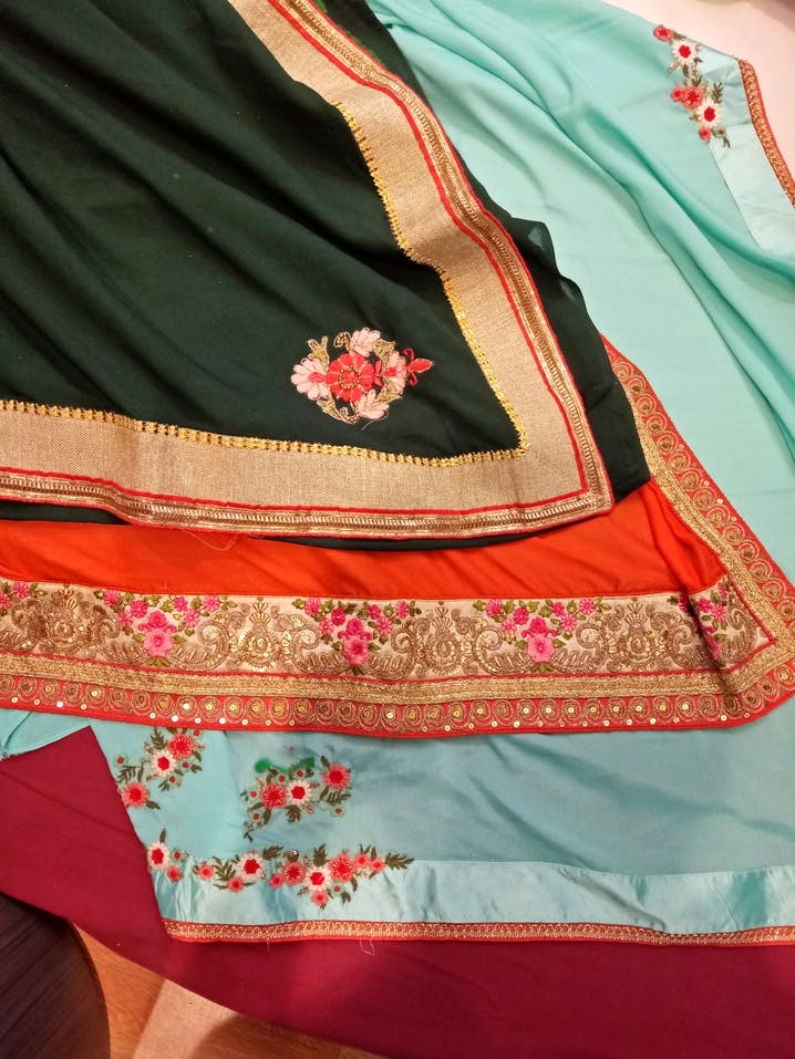 Clothing,Green,Maroon,Magenta,Peach,Orange,Pink,Textile,Embroidery,Sari