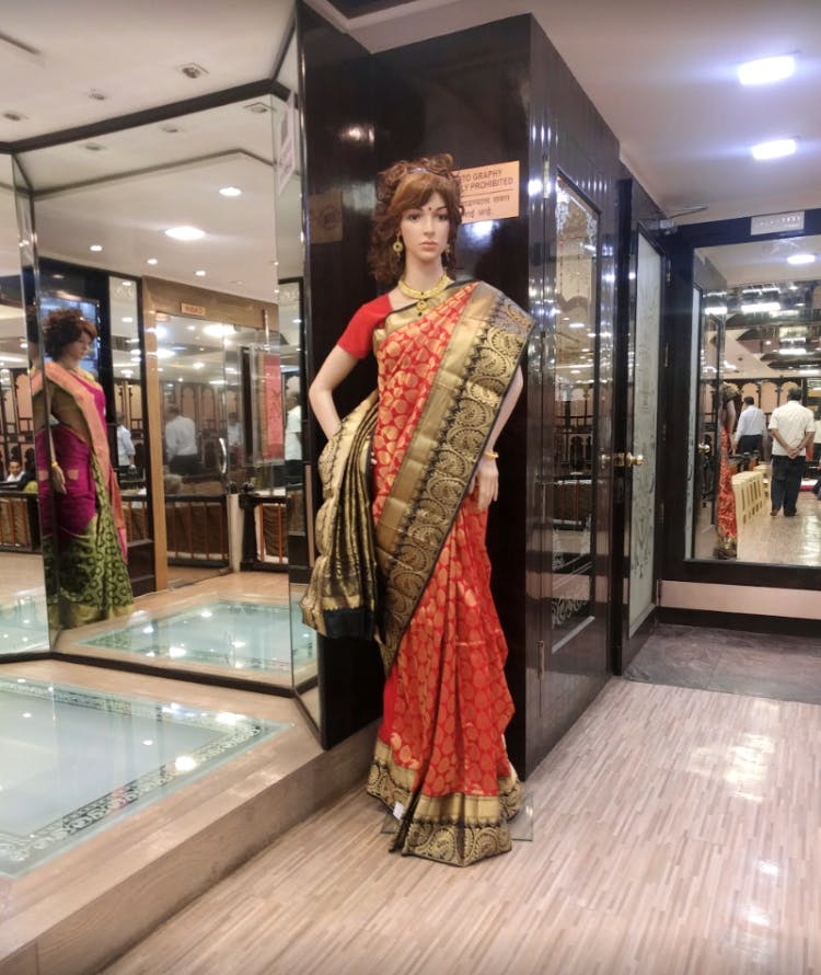 Boutique,Clothing,Sari,Fashion,Shopping mall,Fashion design,Textile,Dress,Display window,Building