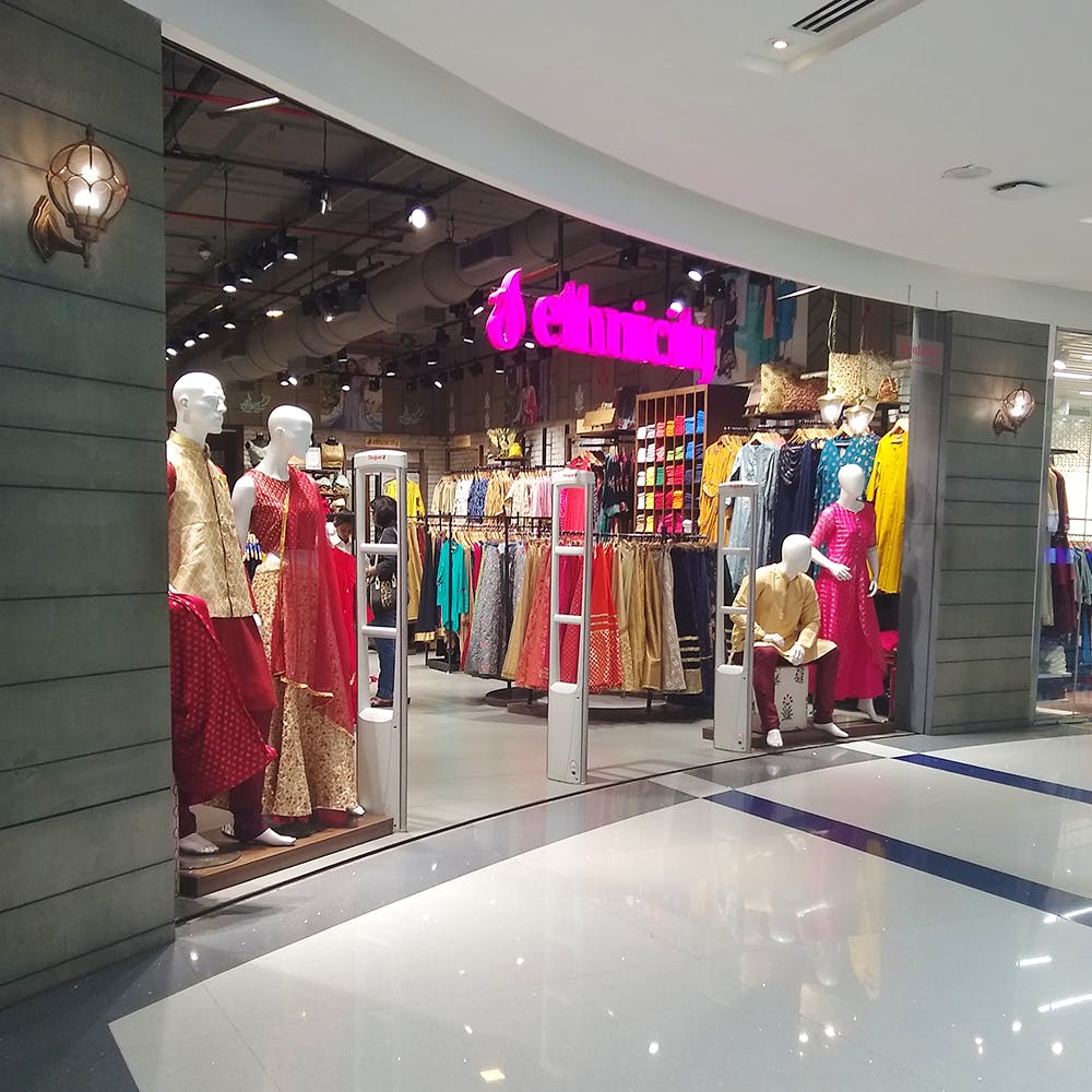 Boutique,Outlet store,Fashion,Shopping mall,Retail,Building,Display window,Interior design,Shopping,Dress