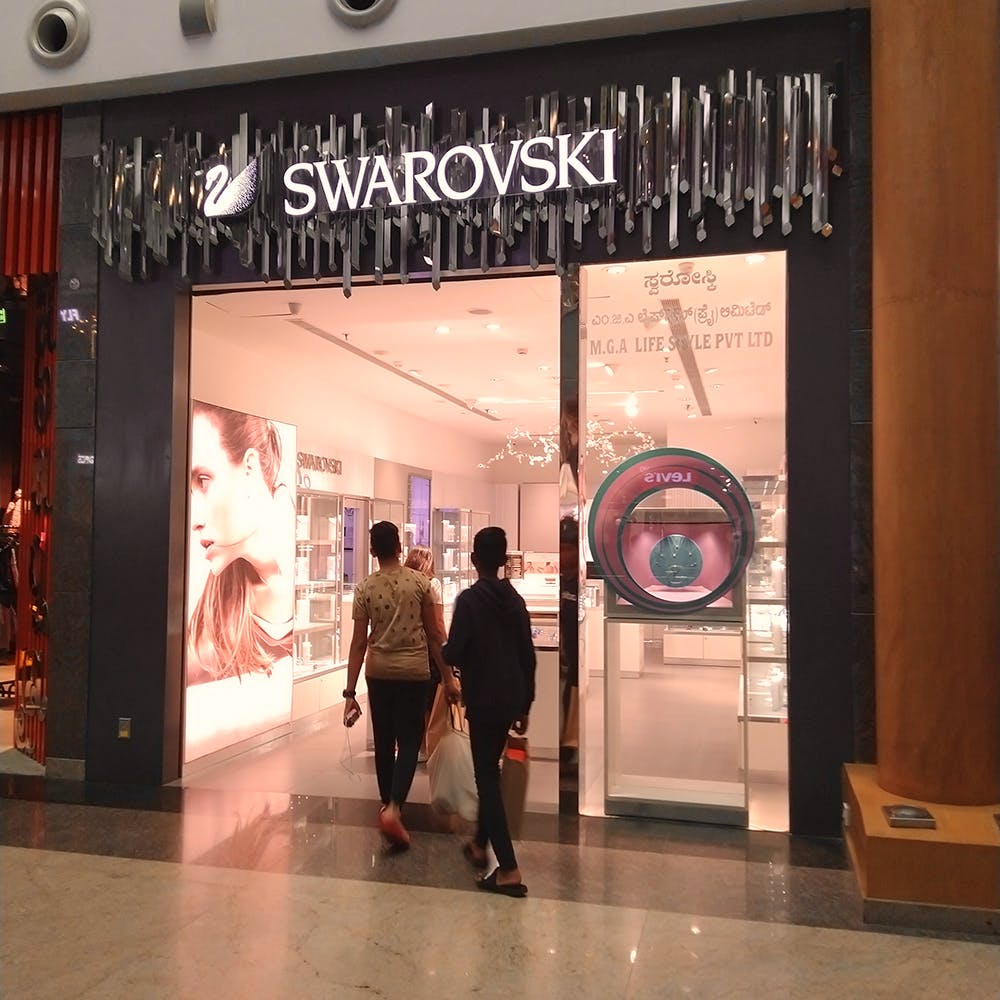 Building,Outlet store,Shopping mall,Display window,Shopping,Advertising,Door,Signage,Retail