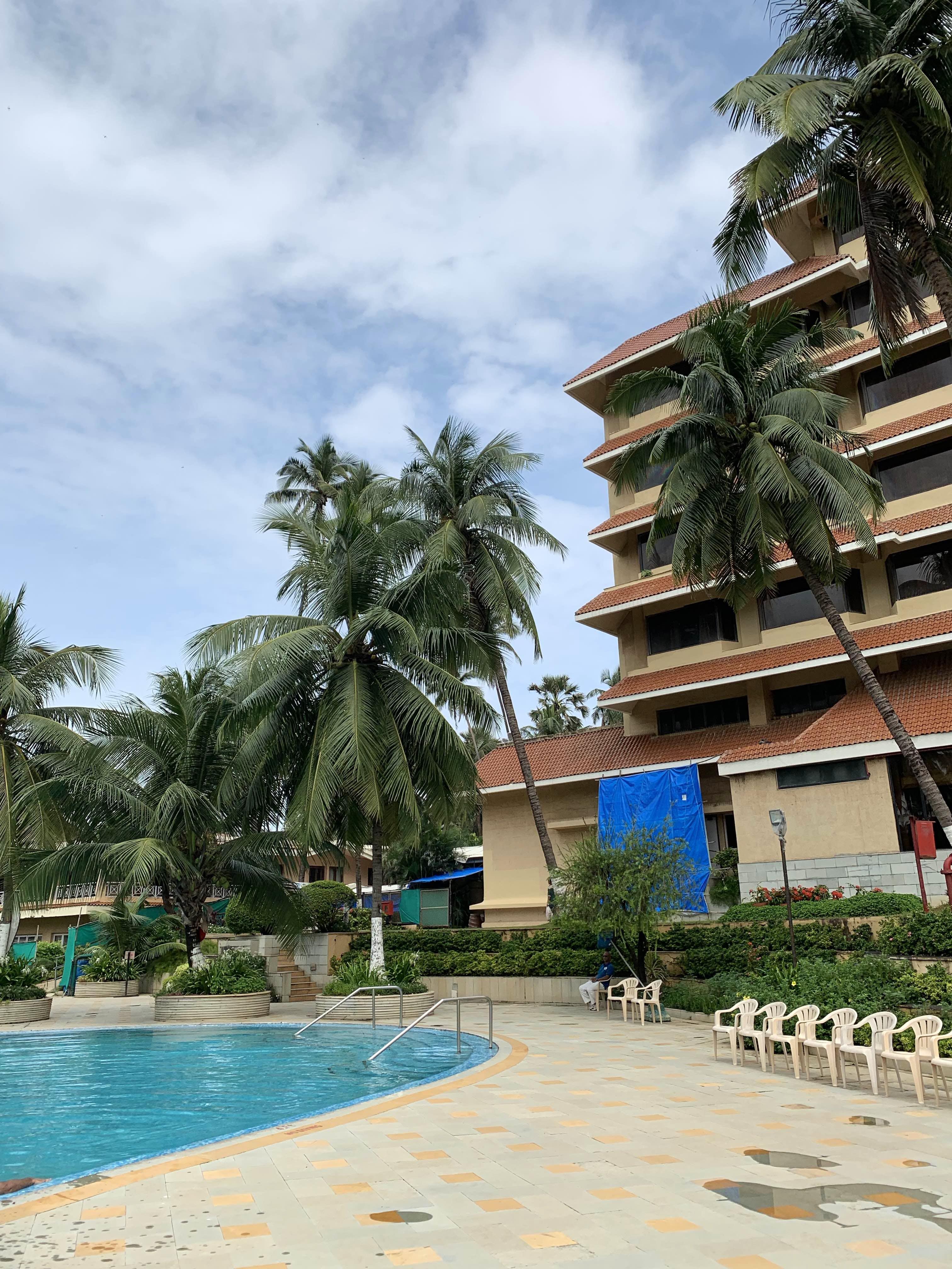 Resort,Swimming pool,Vacation,Building,Tree,Hotel,Leisure,Palm tree,Condominium,Sky